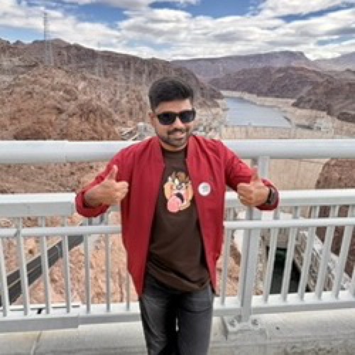 Logesh Thulasiraman, smiling with two thumbs up